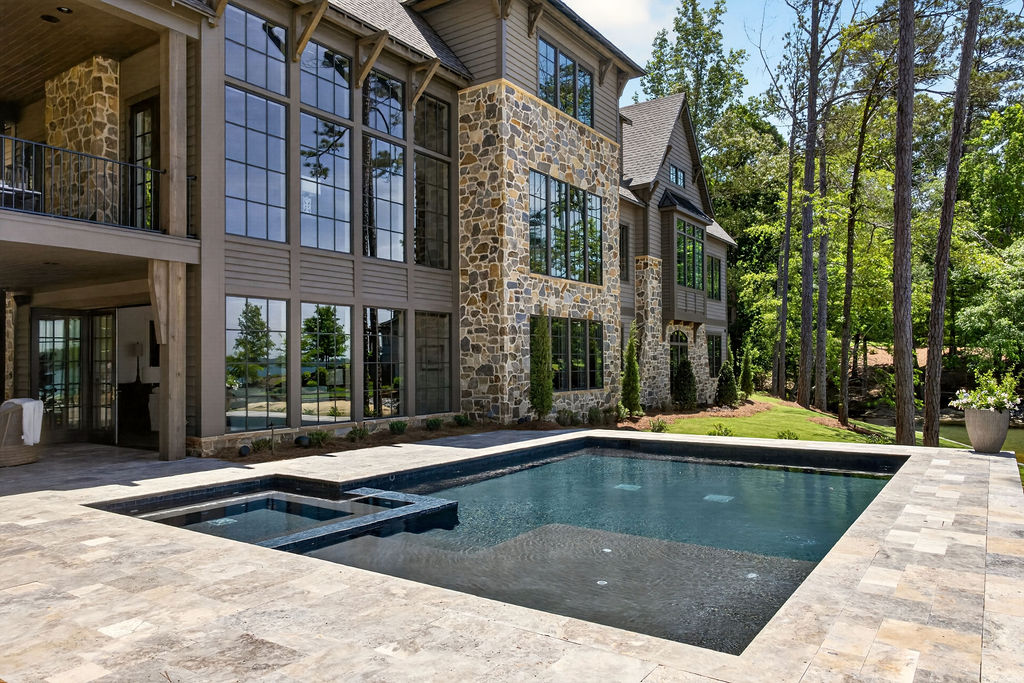 Misty Alabama lakefront with custom pool at dawn